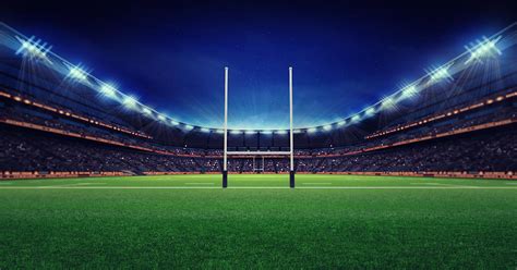Footy Tipping with AFL & NRL footballs on grass Background .